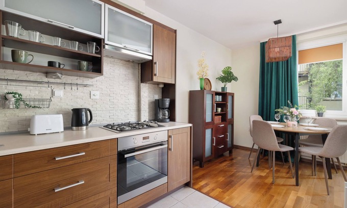 Lagiewniki Apartment | Green and Brown Apartment by Renters