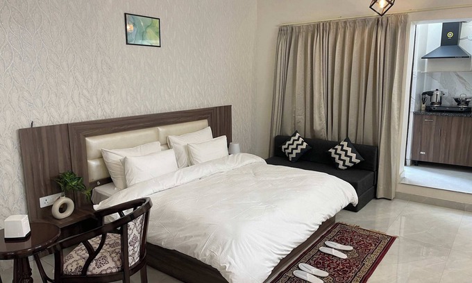 Sector 40 Apartment | Green stays, brighter days.