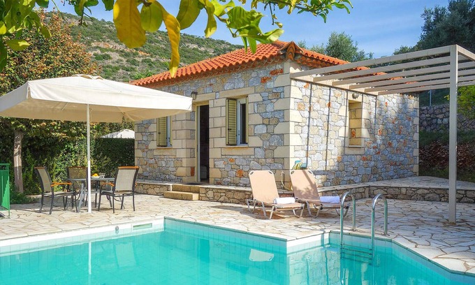 Kardamyli House | Hidden away on the outskirts of the quaint, little village of Kardamili, this traditional stone hous