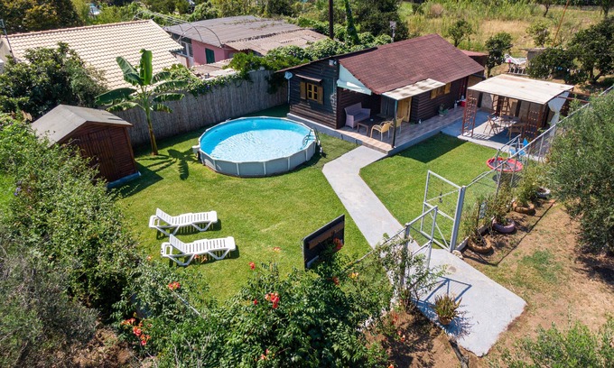 Chalikounas House | Holiday Home 'Wooden House Corfu' with Pool, Garden, Terrace & Wi-Fi