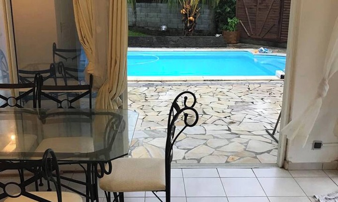 Sainte-Rose Apartment | Homerez - Comfortable Apartment in Sainte-Rose with Shared Pool