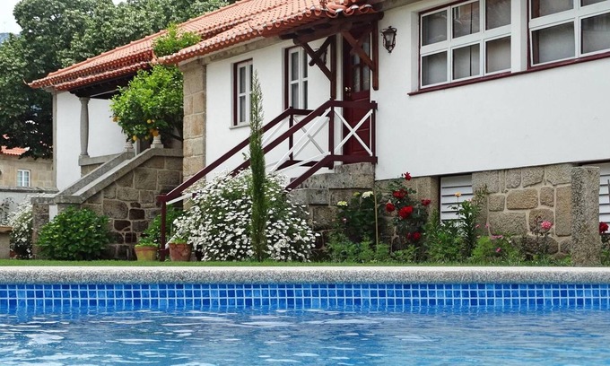 Fatauncos House | Homerez - House for 8 ppl. with shared pool, garden and terrace at Vouzela