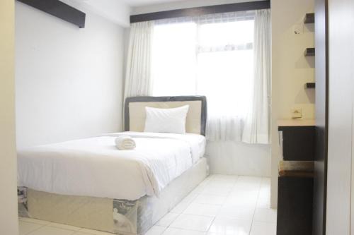 Cipaganti Apartment | Homey 3BR Apartment at The Jarrdin Cihampelas By Travelio
