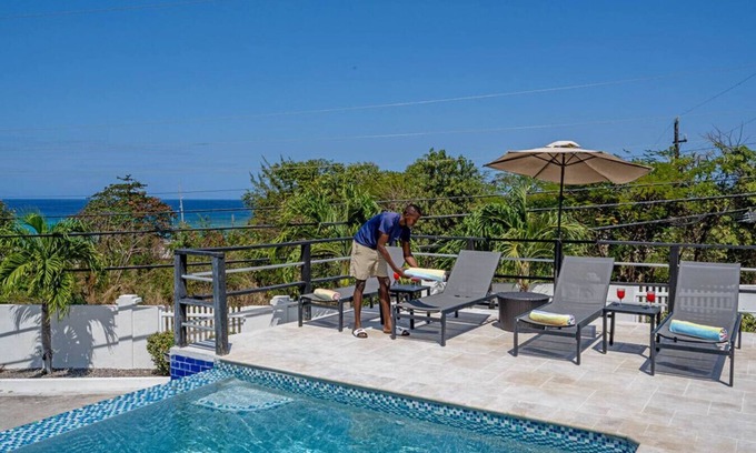IronShore Estates Villa | Hospitality Expert CB2: Pool, Beach & Chef