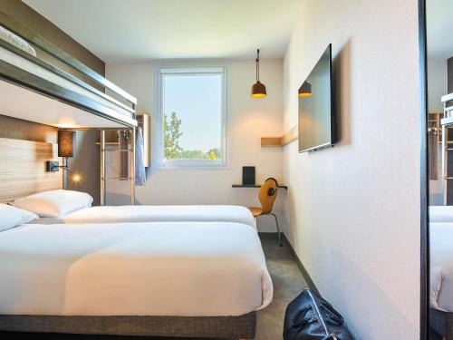 Quartier de la Chapelle Hotel | Ibis Budget Paris porte de la Chapelle - Aréna