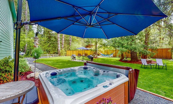 Mason County House | Inviting riverfront home with hot tub, firepit, W/D, & dog-friendly