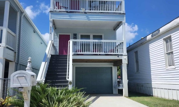 Galveston House | Island House two bedrooms two bath sleeping in the living room golf cart
