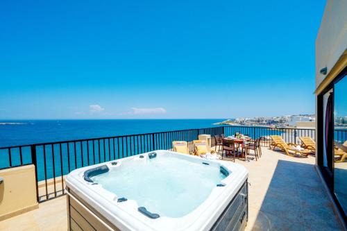 Bugibba Apartment | Islet Promenade Seafront Penthouse with breathtaking seaviews and private hot tub on the large terrace by Getawaysmalta