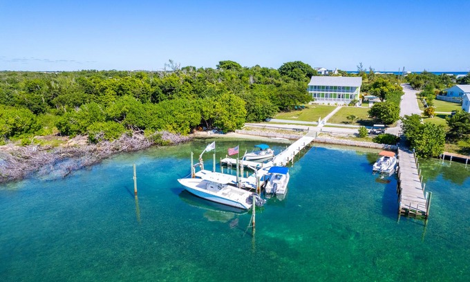 Treasure Cay House | Key Lime House with a 100’ dock: A Solar-Powered Waterfront Oasis on Black Sound
