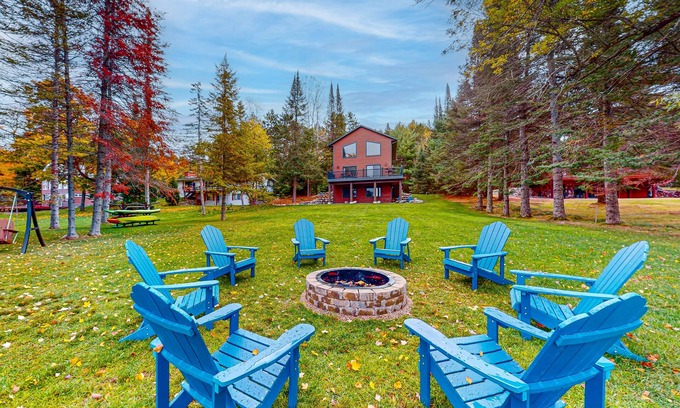 Eagle River House | Lakefront home with yard, private dock, deck, firepit, & washer/dryer