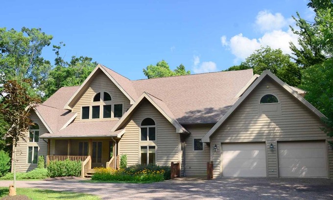 Blakeslee House | Lakefront & pet friendly home in tranquil wooded community w/ private dock!