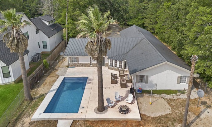 West Livingston House | Lakefront Retreat with Pool, Dock & Game Room
