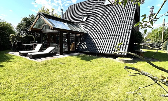 Rustersiel House | Large holiday home on the dike with a winter garden, garden and terrace