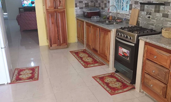 May Pen House | Large spacious 2 bedroom 2 bathroom, secure garage family house.