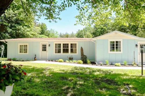 Riverside House | Little Blue Cottage: a wooded getaway near beaches and towns