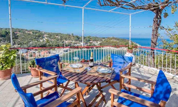 Longos Apartment | Located in the most enviable position, with uninterrupted views of Loggos Harbour and the sea, sits