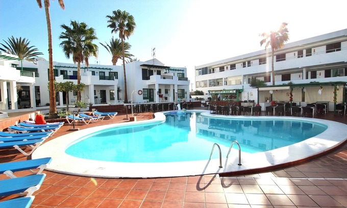 Puerto del Carmen Apartment | Lovely pool view apartment near beach and amenities with Vv license.