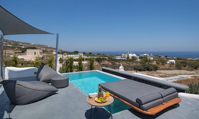 Fira Villa | Masterful Santorini Villa | Villa Zacharias | 4 Bedrooms | Outdoor Dining Area.