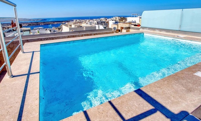 Mellieha Apartment | Mellieha 3BR home with Rooftop Pool Access w/AC's