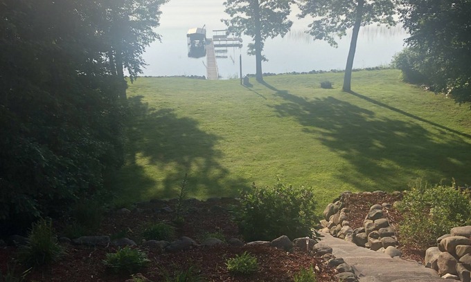 Ossipee House | Mission Lake home with dock and sandy bottom