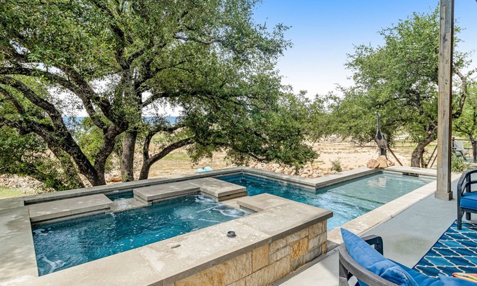 Burnet House | Modern charmer with gleaming lake views, pool, fireplace, & grill - dog-friendly