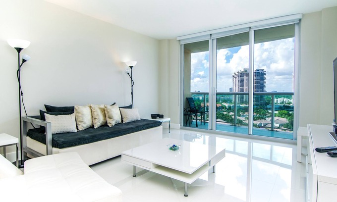 Sunny Isles Beach Condo | Modern condo w/bay views. WiFi, parking, tennis, playground and more!