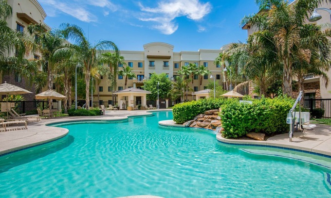 Glendale Sports and Entertainment District Apartment | Modern Phoenix Suite + Walk to Gila River Arena | Heated Outdoor Pool