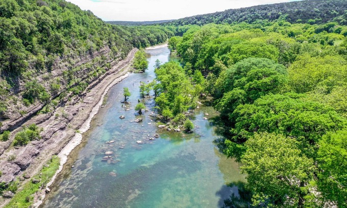 New Braunfels House | Modern river cabin with the Guadalupe River right in your backyard!
