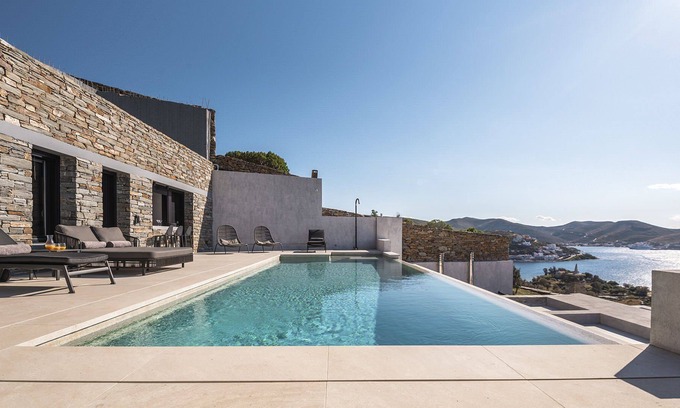 Vourkari Villa | My Rental Homes - Villa Kronos with lounge area and a heated Jacuzzi-plunge pool.