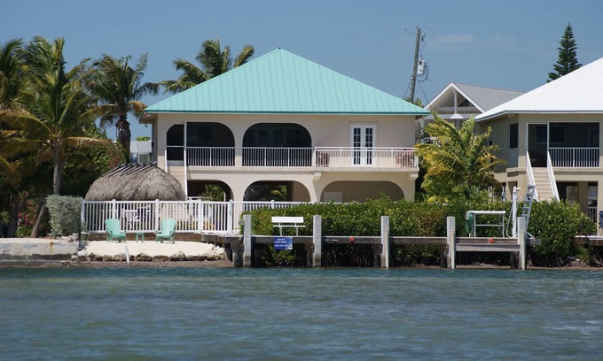 Breezeswept Beach Estates House | Oceanfront Rental With Heated Pool, Dock & Tiki Hut