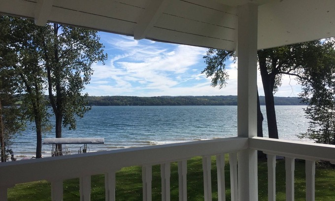 Auburn Cottage | Owasco Lake front seasonal cottage with level yard and beach