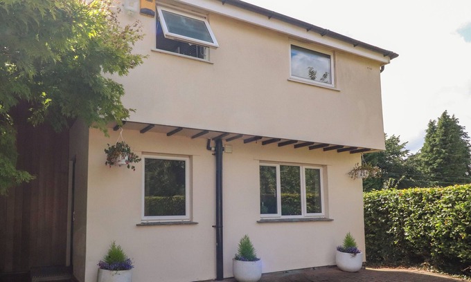 Burton Cottage | PALM COURT, pet friendly, with a garden in Burton-In-Kendal