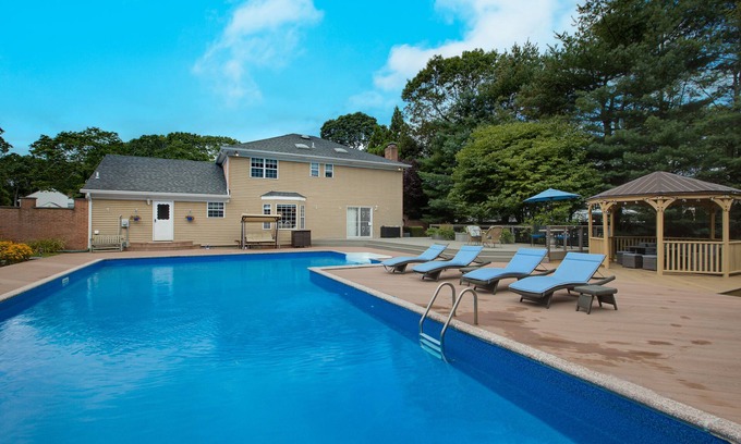 Shirley House | Peaceful Beach Retreat - Heated Pool, Big Backyard, Mini-Bar & Game Room