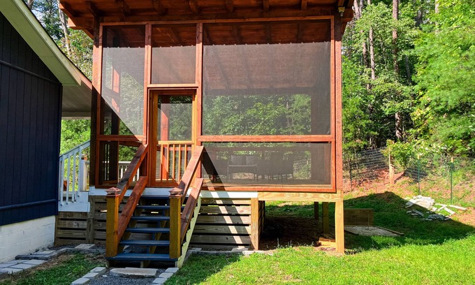 Epworth Cottage | Quaint wooded escape with wraparound deck, firepit, & fast WiFi - dog-friendly