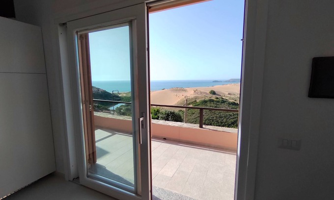 Torre dei Corsari Apartment | Renovated house overlooking dunes and pristine sea.