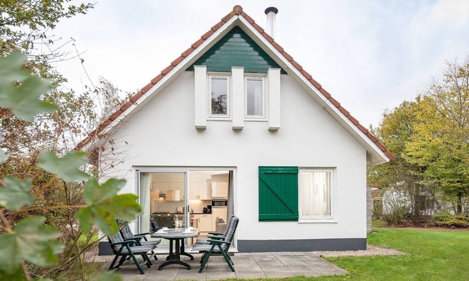 Hoogersmilde House | Restyled house with fireplace, surrounded by green