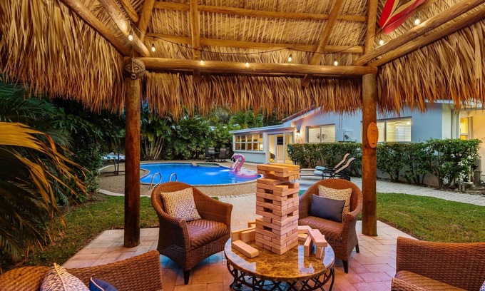 Lighthouse Point House | Retro 1950s Florida Home ~ Pool ~ Spa ~ Tiki Hut ~ Huge Backyard ~ Hammock ~ Two Bikes