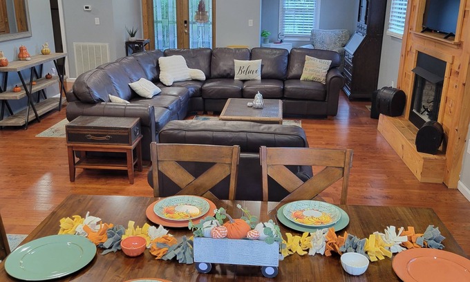 Cosby Cabin | Riverfront cabin near the Smoky Mountains with a hot tub.