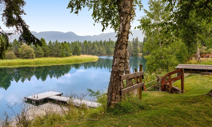 Bigfork House | Riverfront home with private dock, kayaks, 150+ ft Swan River frontage - dogs OK