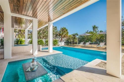 Anna Maria House | Sea La Vie Beach House - Luxurious 4BR Home W Pool Spa Dock Canal Access on Anna Maria Island