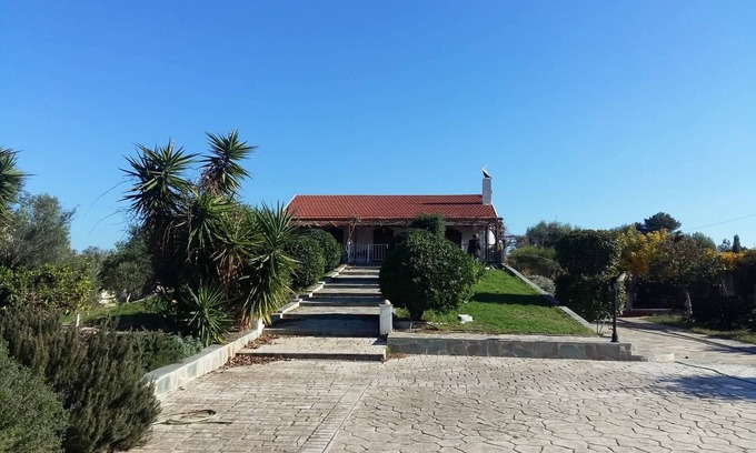 Chalcis Cottage | Seafront cottage with orchard and garden