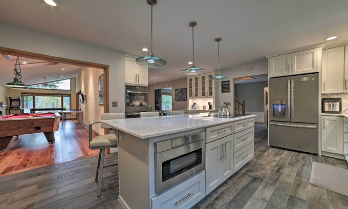 Rapid City House | Serene Riverfront Home w/Torch Lake Access!