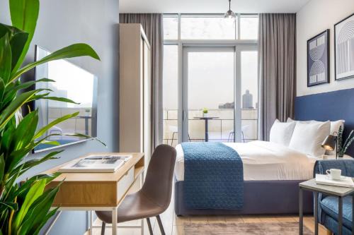 Bur Dubai Apartment | Silkhaus modish studio with Burj Khalifa view, pool access