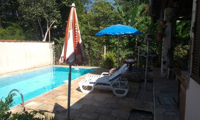 Itamambuca House | Single-storey house with swimming pool.
