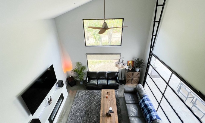 Stevensville House | Sleek forest retreat: karaoke, spa, campfire, pool table, grill, outdoor games