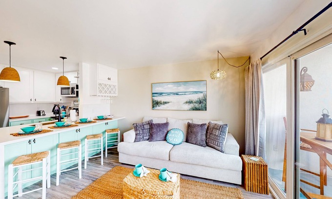 South Oceanside Condo | Sound view condo with modern interior, gas fireplace, balcony, & W/D access