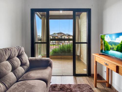 Campos do Jordao Apartment | Spacious Balcony 2 bedrooms Heater
