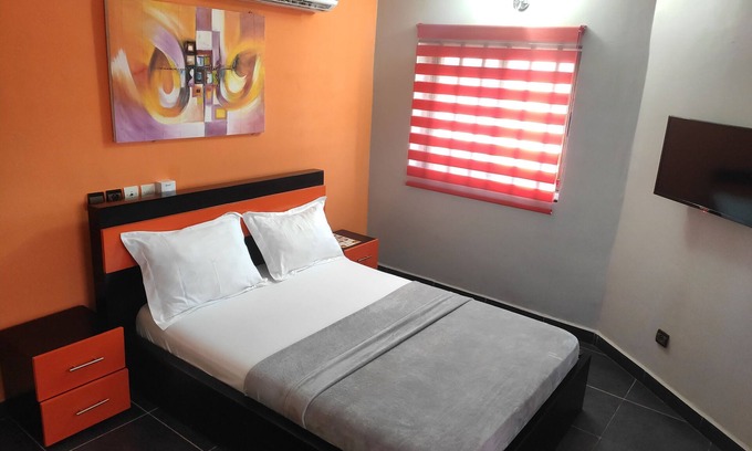 Lome House | Standard Double Bed in Royal Blue Guest House and Bar
