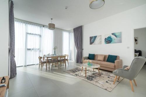 Dubai Investment Park Apartment | StoneTree - Furnished 2BR with floor-to-ceiling window
