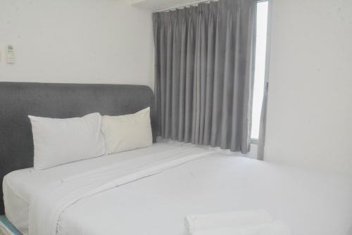Jatinegara Apartment | Strategic and Minimalist 2BR at Bassura City Apartment By Travelio